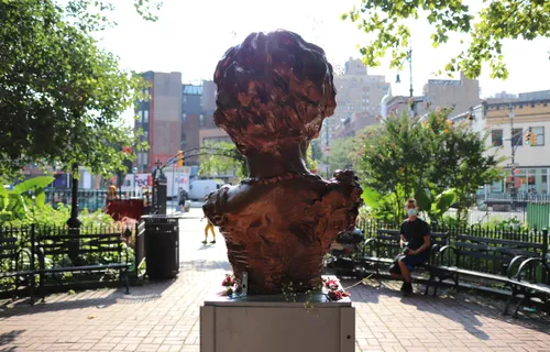 Rear view of the Marsha P. Johnson bust, looking toward the park entrance