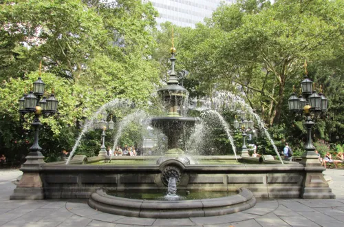 The Jacob Wrey Mould Fountain sparkles amid the park’s greenery