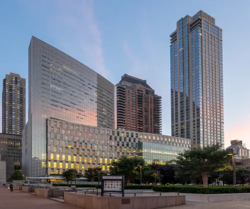 Damrosch Park and surrounding buildings on a quiet evening