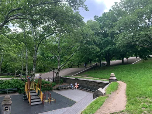 Playground equipment with wide stairs leading up to the monument
