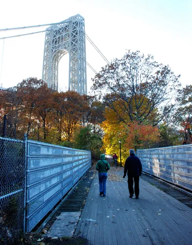 Walking path beneath the George Washington Bridge during fall