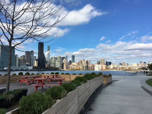 The waterfront promenade curves along the East River
