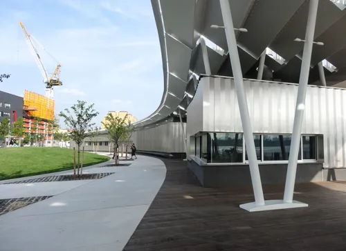The curved pavilion canopy with its distinctive pleated steel structure