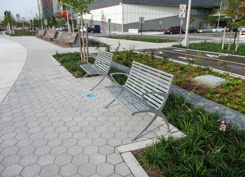 Benches along the pathway overlook the waterfront promenade