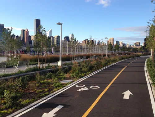 A dedicated bike lane runs parallel to Center Boulevard