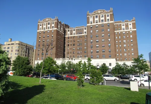Grand Concourse runs along the park's eastern edge with residential buildings in the background