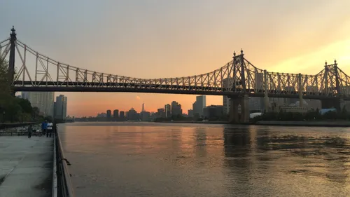 The Ed Koch Queensboro Bridge spans the East River at sundown