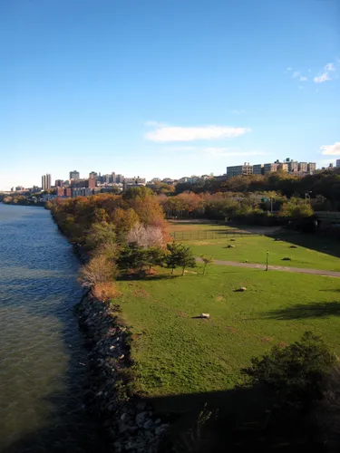 Vibrant autumn foliage lines the Hudson River shoreline