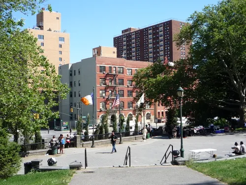 Urban plaza with apartment buildings overlooking the park grounds
