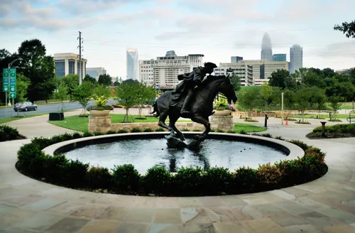 Captain James Jack statue gallops in a circular fountain