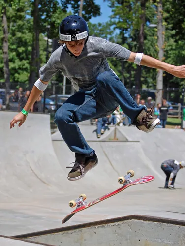 Skateboarder performing a trick at the skate park
