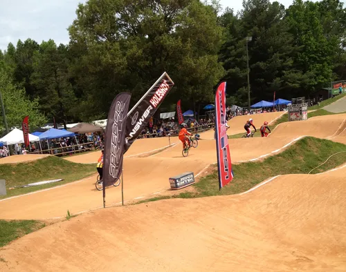 Riders navigate the dirt track at the Hornets Nest BMX course