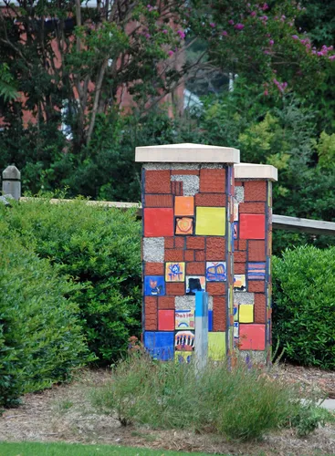 Colorful decorative pillars adorn the entrances at Progress Park