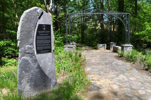 Memorial stone and entrance path to the park