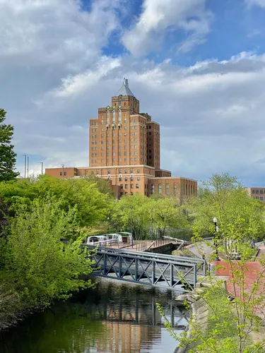 An Art Deco building rises above Lock 2 Park and the canal