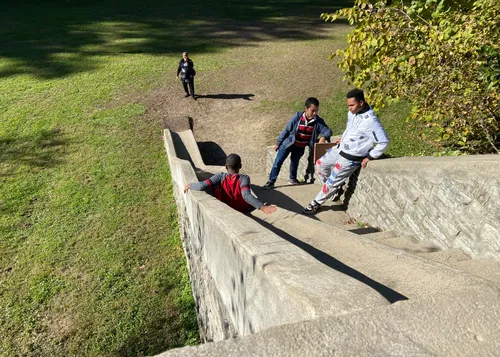 Kids enjoy the stone slide from 1940 near the Trailside Nature Center