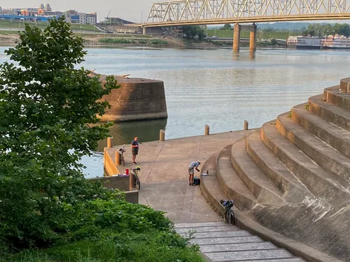 Cyclists taking a break near the iconic Serpentine Wall steps