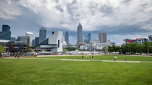 Open green lawn under dramatic clouds