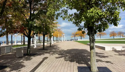 Wide waterfront walkways provide ample space for exploring the park