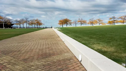 Diagonal pathway cutting across the park's rectangular lawn area