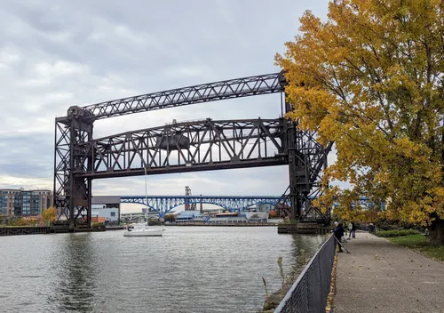 The Iron Curtain Bridge spans the Cuyahoga River at the park's eastern edge