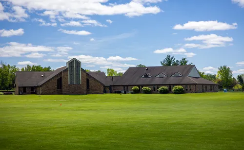 Large lawn across from the park, with University Baptist Church visible