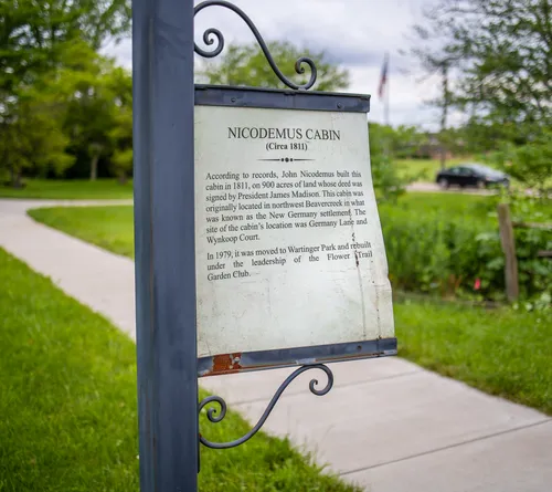 Informational sign detailing the history of Nicodemus Cabin
