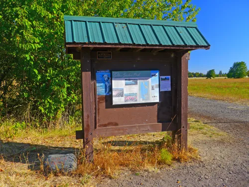 This covered information kiosk sits by the trail