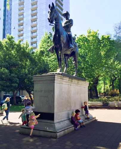 Equestrian statue of Theodore Roosevelt stands tall on its pedestal
