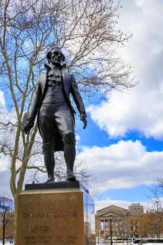 Bronze statue of Thomas Fitzsimons against winter sky