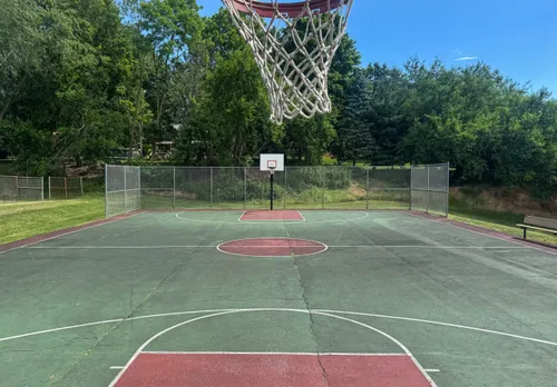 The park's basketball court on a bright summer day