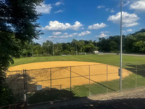 Moore Park's baseball diamond under a bright blue sky