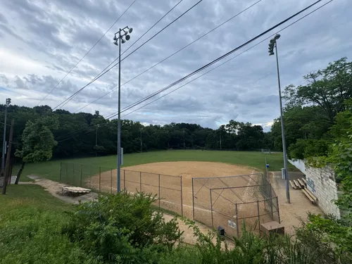 The baseball field with lighting towers rising above