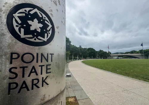 An entrance marker for Point State Park at the bean-shaped east lawn