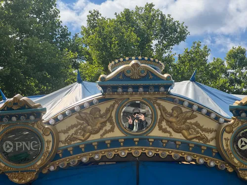 The PNC Carousel with its ornate gold and blue detailing