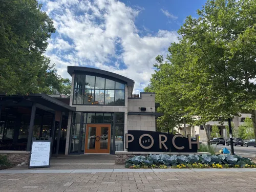 The Porch restaurant is lined with trees on both sides