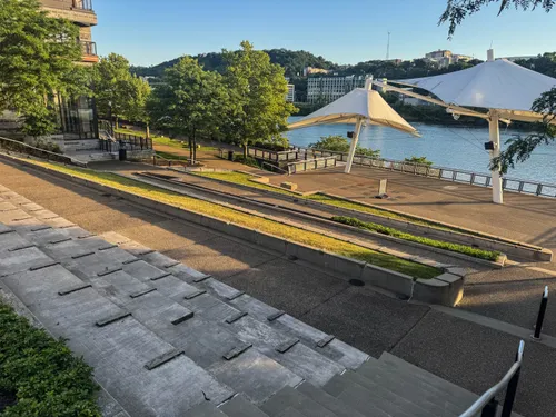 An amphitheater-style waterfront terrace offers gorgeous river views