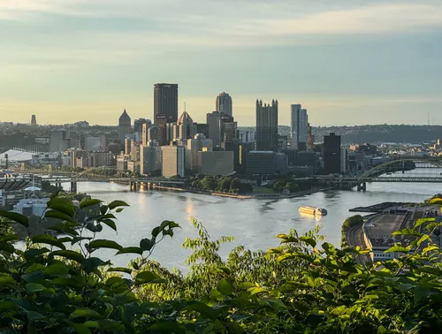 Pittsburgh's skyline rises above the river confluence to the east