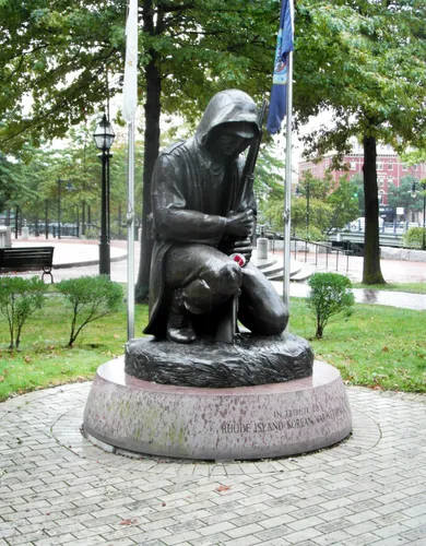 The Korean War Memorial depicts a solemn soldier amid commemorative bricks