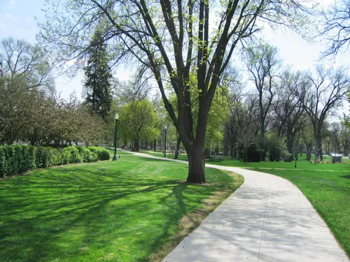 A long pathway crosses the park north to south