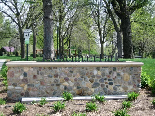 The McKennan Park sign lettered along a stone wall at the entrance