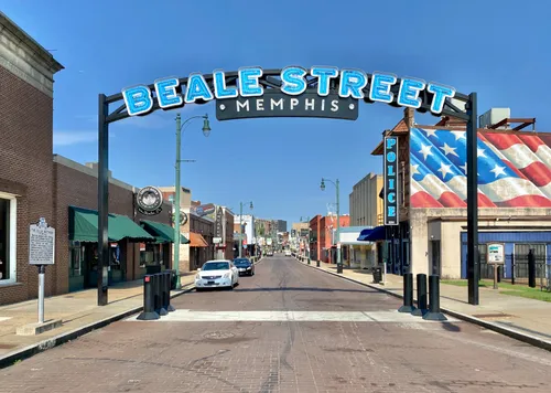 The iconic Beale Street entrance arch welcomes visitors to Memphis' historic district
