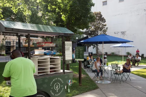 Visitors relax at the park's outdoor seating area