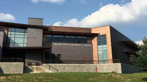 The Sevier Park Community Center viewed from the lawn on a sunny day