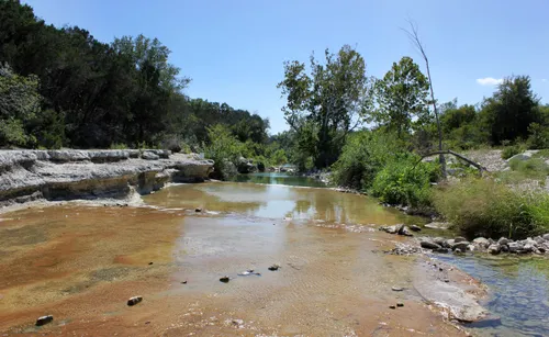 Gentle flow of the creek carving its path through the Austin landscape