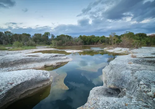 Smooth rock formations around natural pools along Onion Creek