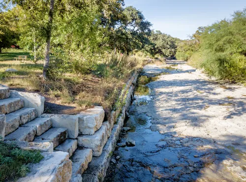 Steps leading down to a shallow section of the creek