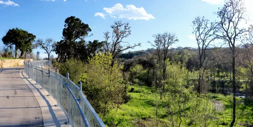 A bike path overlooking the park greenery