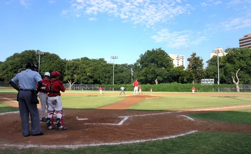 Baseball game in progress at the park's diamond field