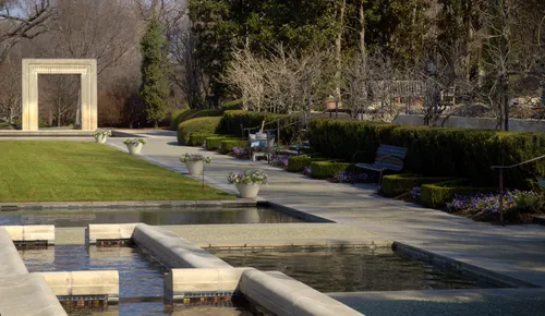 Wide walkways and reflecting pools in A Woman's Garden